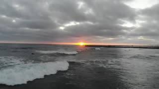 Surfing in Oceanside Sunset Drone Shots