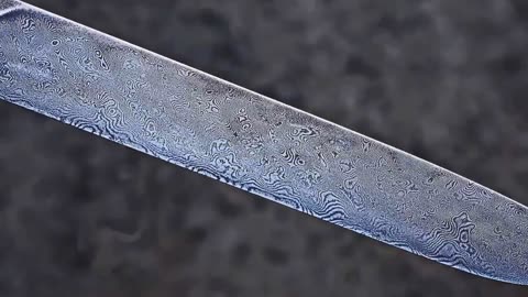 Damascus steel from two tape measures and 100 blades of stationery knives9