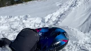 Sledding Kid Face Plants Into Snow Pile