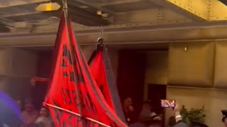 Climate change activists blocking entrances of the Federal Reserve in downtown Manhattan