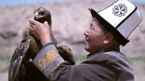 Hunter Feeding Golden Eagle