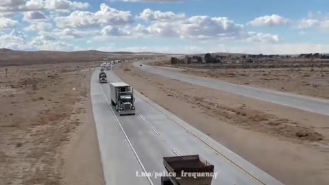 Freedom Convoy USA is heading East making its way through California. The view from the bridge as the thousands of truckers and vehicles pass through