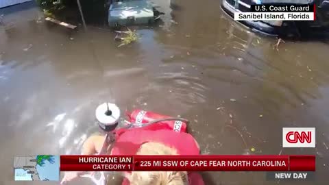 Watch US Coast Guard rescue woman from flooded neighborhood
