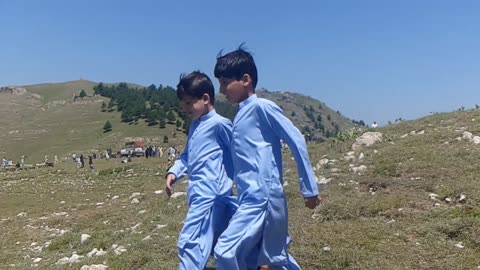 Two cute brothers stylish walking.