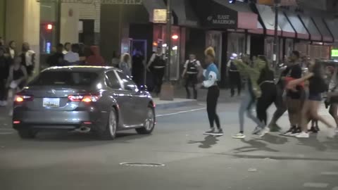 2 teens shot downtown Chicago as large crowds gather; some seen dancing on cars
