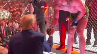 UFC fighter jumps over cage to greet Trump after TKO win