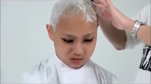 Girl loses game and gets her head shaved bald