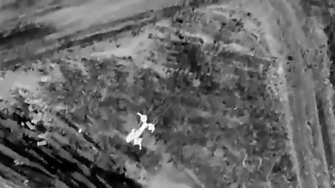 Ukrainian drone attacks Russians evacuating a wounded. Thermal video.