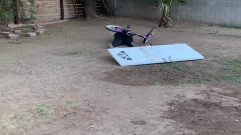 Woman Fails to Ride Up Makeshift Bike Ramp