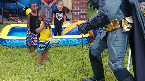 Houston superhero party character batman uses the batshield & batarang at a birthday in Humble, TX.