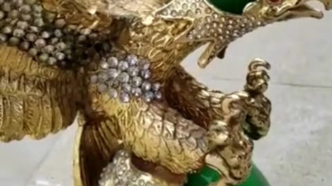Golden Eagle on selling with 1330 carats green Emerald and rear rest bloody emeralds