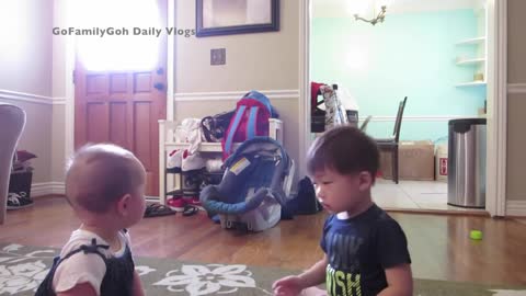 Precious toddler stops crying baby with kiss