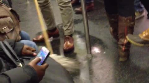 Man mopping the subway floors