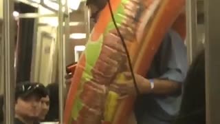 Guy with donut hamburger blow up toy subway