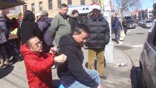 Luodong Briefly Massages Chinese Man In Black Hoodie On Sidewalk