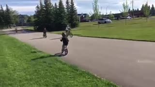 Little boy rides bike and crashes into another bike