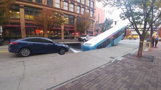 Sinkhole Swallows Up City Bus