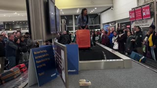 Airport Employee Carries Baggage After Belt Breaks