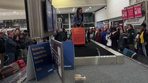 Airport Employee Carries Baggage After Belt Breaks