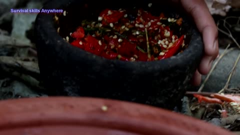 A girl cooking cauliflower in primitive style