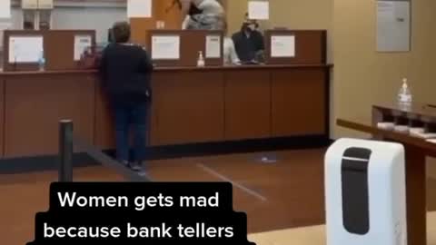Woman gets mad because her check was taken at the bank for overdraft