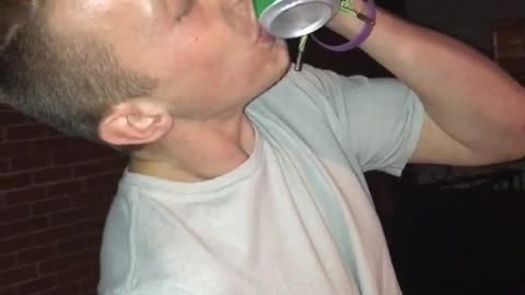 Guy grey shirt drinking four loko and tossing can