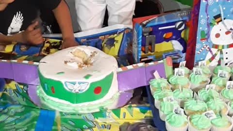 Boy Buries Head into Birthday Cake