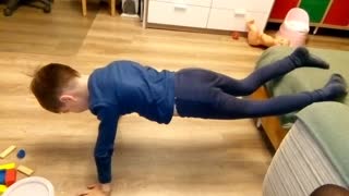 Funny kid trying to get strong