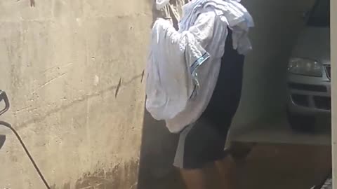 Husband Gets Down as He Hangs Clothes Up