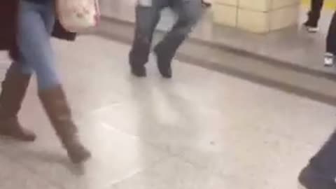Guy green jacket black puffy jacket dancing subway