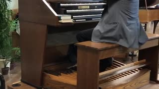 Erikson plays organ at Warner Hall, Royal Palm Presbyterian Church