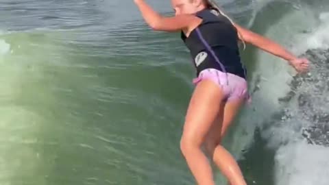 She's only nine years old, surfing