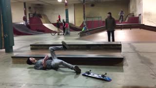 Black beanie side skateboard slam