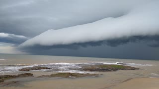 Intense Stormcloud Sweeps Across Sea