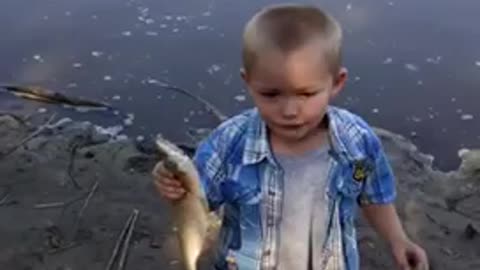 Cute little boy wants to keep the fish for himself!!