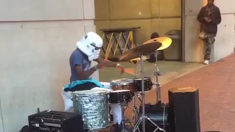 Playing drums with storm trooper mask on