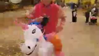 Slow mo man riding his unicorn