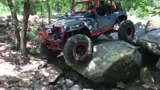 Superman Jeep playing on some little rocks at Burris Valley