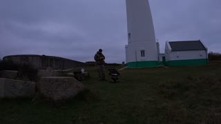 Timelapse next to a castle and lighthouse