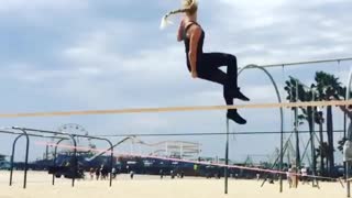 Girl bouncing on tightrope bad landing