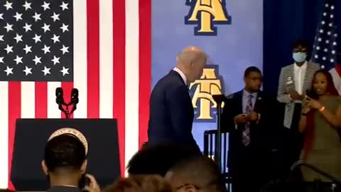 Joe Biden tries to shake hand with an imaginary person or kid , how would i know , cmon man