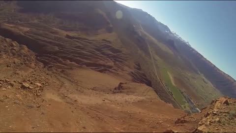 BASE jumper flies away after scary cliff strike