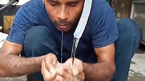 Man washing hand and mouth with new technique called dasi jughar