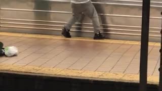 Man grey outfit hat dancing exercising on train