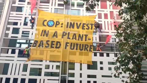 Climate activists scale Home Office building in London to call for 'plant-based future'