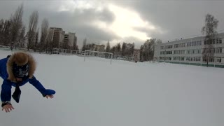 Dad Launches Kid into the Snow