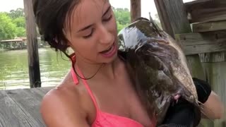 Woman catches fish in totally awesome way