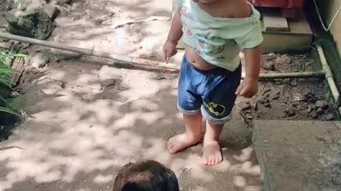 Boy Playing Catch Me If You Can With His Chicken Buddy