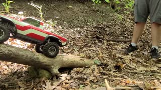 RC truck crawling up two logs - Traxxas TRX-4 Sport - RC4wd MUD SLINGER XL 1.9" TIRES
