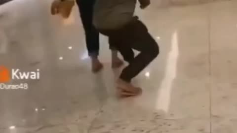 Husband teasing his wife in the mall